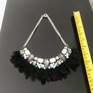 Rhinestone and feather necklace